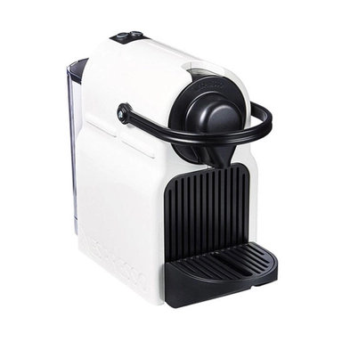 Compact white Nespresso espresso machine with front-loading capsule system.