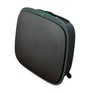Dark gray AEG AX9 or similar compact air purifier with fabric front and leather handle.