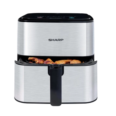 Sharp stainless steel air fryer with open basket and cooked chicken inside.