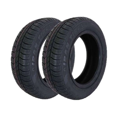 Pair of Yazd Tire tires on alloy wheels with a red sidewall stripe.