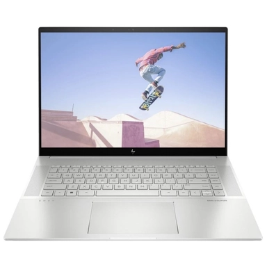 HP laptop displaying a skateboarder performing a jump on screen.