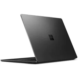Black Microsoft Surface laptop partially open on white background