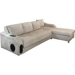 Light beige L-shaped sofa with built-in cup holder and side speaker openings.