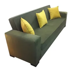 Dark green sofa with wide arms and yellow accent pillows.