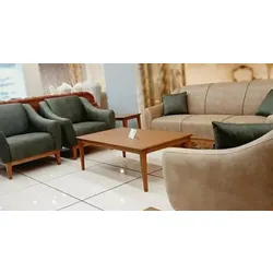 Modern living room set with beige and green upholstered sofas and wooden coffee table