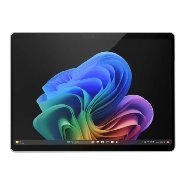 Microsoft Surface tablet with colorful abstract wallpaper on screen.