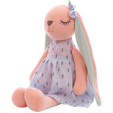 Soft pink bunny plush toy wearing a light purple dress and a matching bow on its ear.