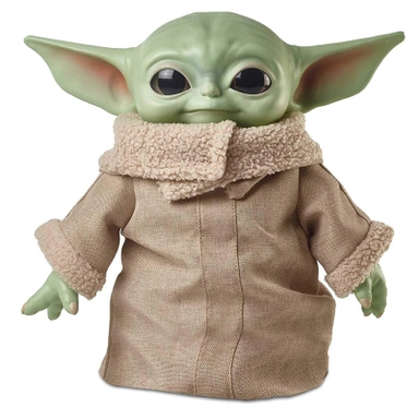 Baby Yoda plush toy wearing beige robe from The Mandalorian series