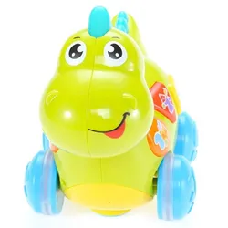 Green dinosaur toy with blue wheels and smiling face for children